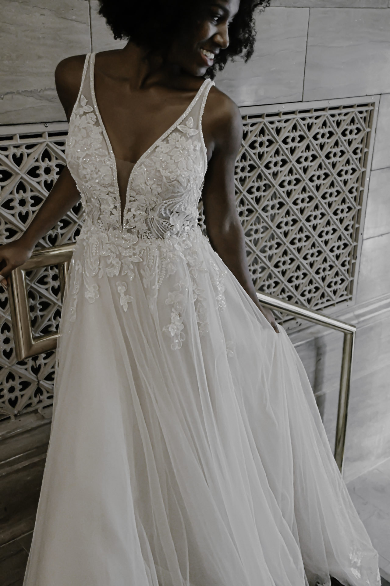 Oneshoulder wedding dress with asymmetrical floral embroidery